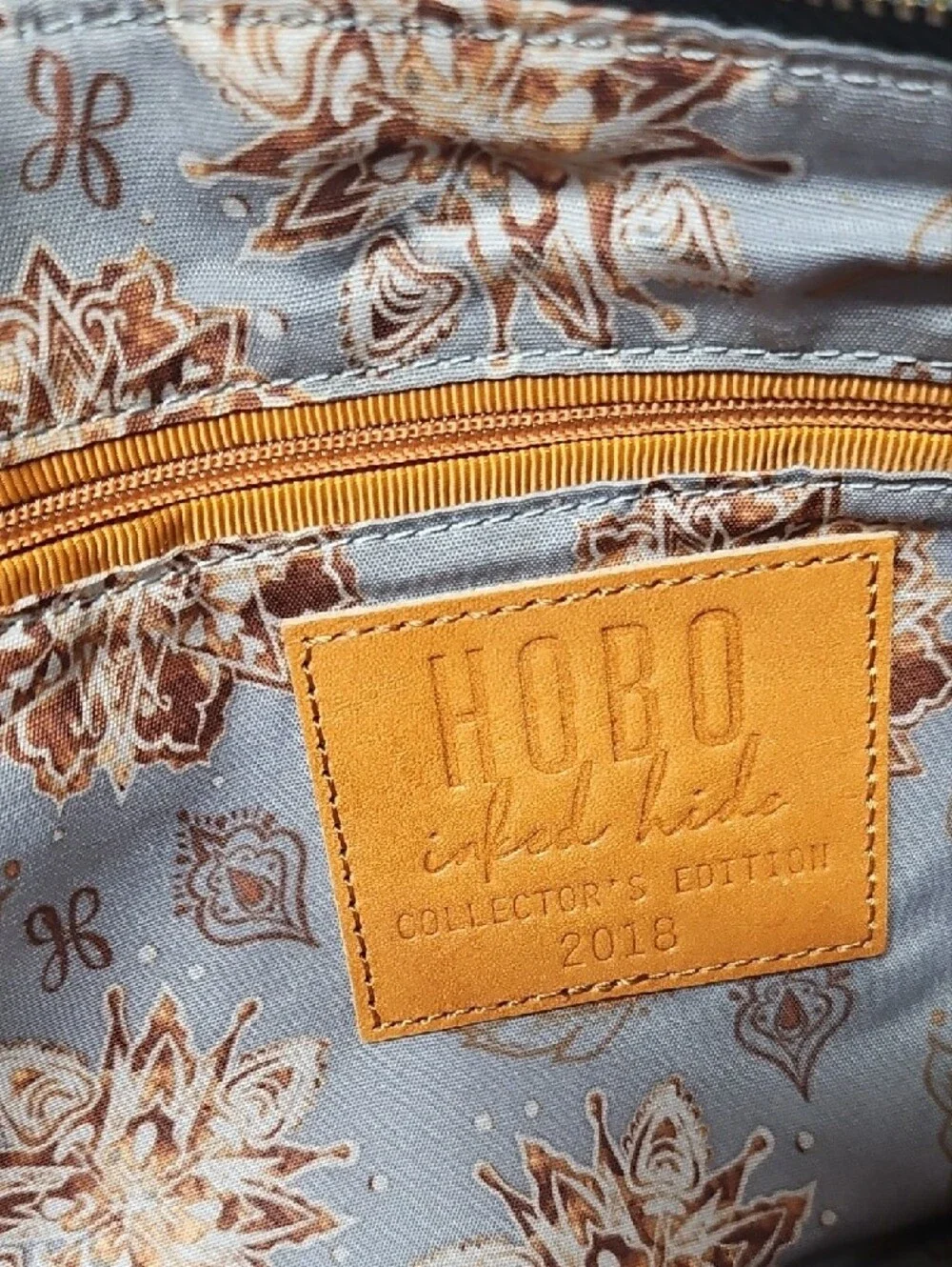 HOBO Inked Hyde 2018 Collectors Edition Gray Embossed Floral Wristlet